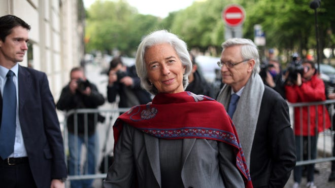  IMF chief Christine Lagarde says a Paris court has named her as a key witness in an investigation into a controversial payoff to an outspoken businessman arranged while she was France's finance minister.